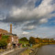 Warneton : landscape of the Lys river with church and old local beer factory - static time lapse