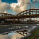 Mouscron, the Pont Blanc, tied arch bridge over the railway tracks - static time lapse