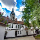 Kortrijk typical landscape : flemish beguinage and Sint Maarten church - static time lapse