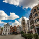 Kortrijk Grote Markt :  old and modern buildings near Sint Maarten church - static time lapse