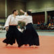 Man and woman practising aikido martial art  in Blocry sports center - static real time