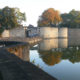 Ypres in autumn : Lille Gate fortification alongside the ramparts - dolly shot real time