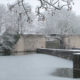 Ypres in winter : Lille Gate and city old fortifications city after snow fall - dolly shot real time