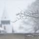 Winter scenery : frozen trees and church after snow fall near Ypres Lille Gate - dolly shot real time