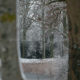 Winter nature shot : snow scenery with pond, trees and fishing piers - dolly shot real time