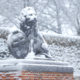 Menin Gate in the snow : the lion holding the Ypres Coat of Arms - dolly shot real time