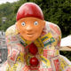 Art in the streets of Spa : the Pierrot mascot and the Bobelines pavilion - dolly shot real time