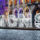 Enlightened gothic facade of Mons City Hall during Christmas time - handheld shot real time