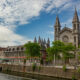 Tournai city skyline : churches and towers along Escaut river banks - static time lapse