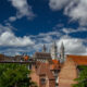 Fluffy clouds above the gorgeous Tournai Cathédrale Notre-Dame - static time lapse