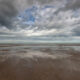 Beautiful sky above the North Sea at De Panne beach in Belgium - static time lapse