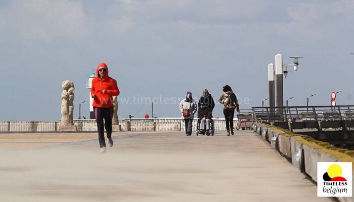 Woman running on harbour walkway