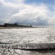 Belgian Coast landscape : sand, waves, clouds and line of buildings - static real time