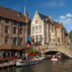 Bruges water canals summer scenery : tour boats embankment pier - static time lapse