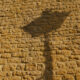 Sunset light and shadow on traditional stone wall  in South Belgium - dolly shot real time